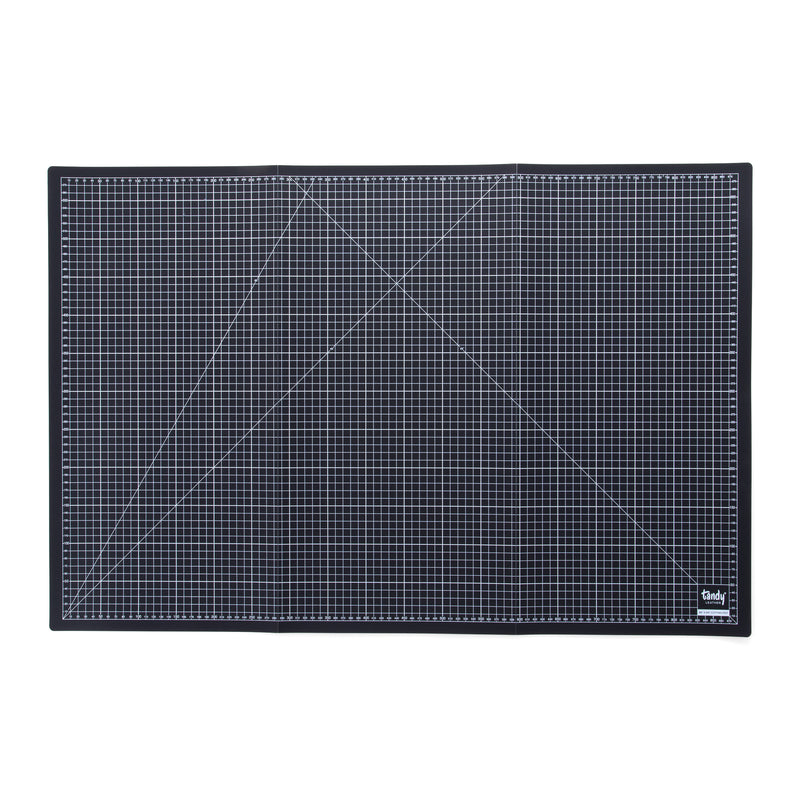 Alfombrilla de corte plegable cuadriculada