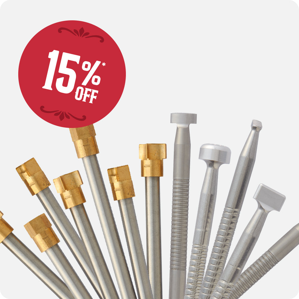A set of brass & stainless steel stamps, arranged in a fan shape against a light gray background, featuring a red circular '15% OFF' promotional badge.