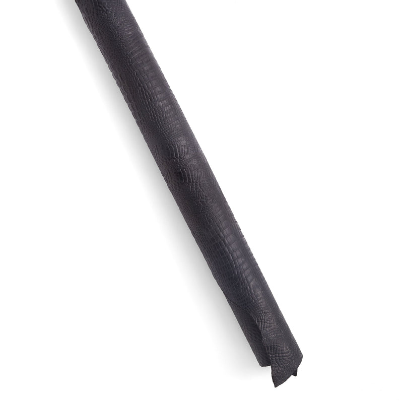 Lado negro con relieve de cocodrilo