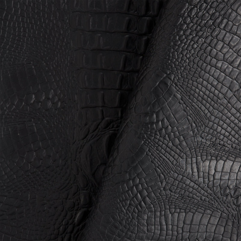 Lado negro con relieve de cocodrilo
